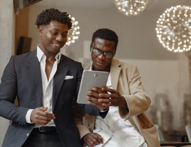 salesperson showing his tablet to a buyer